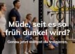 Mitglieder lachen gemeinsam beim Training bei BRIZZLY in Villach, Text im Bild: Müde, seit es so früh dunkel wird?